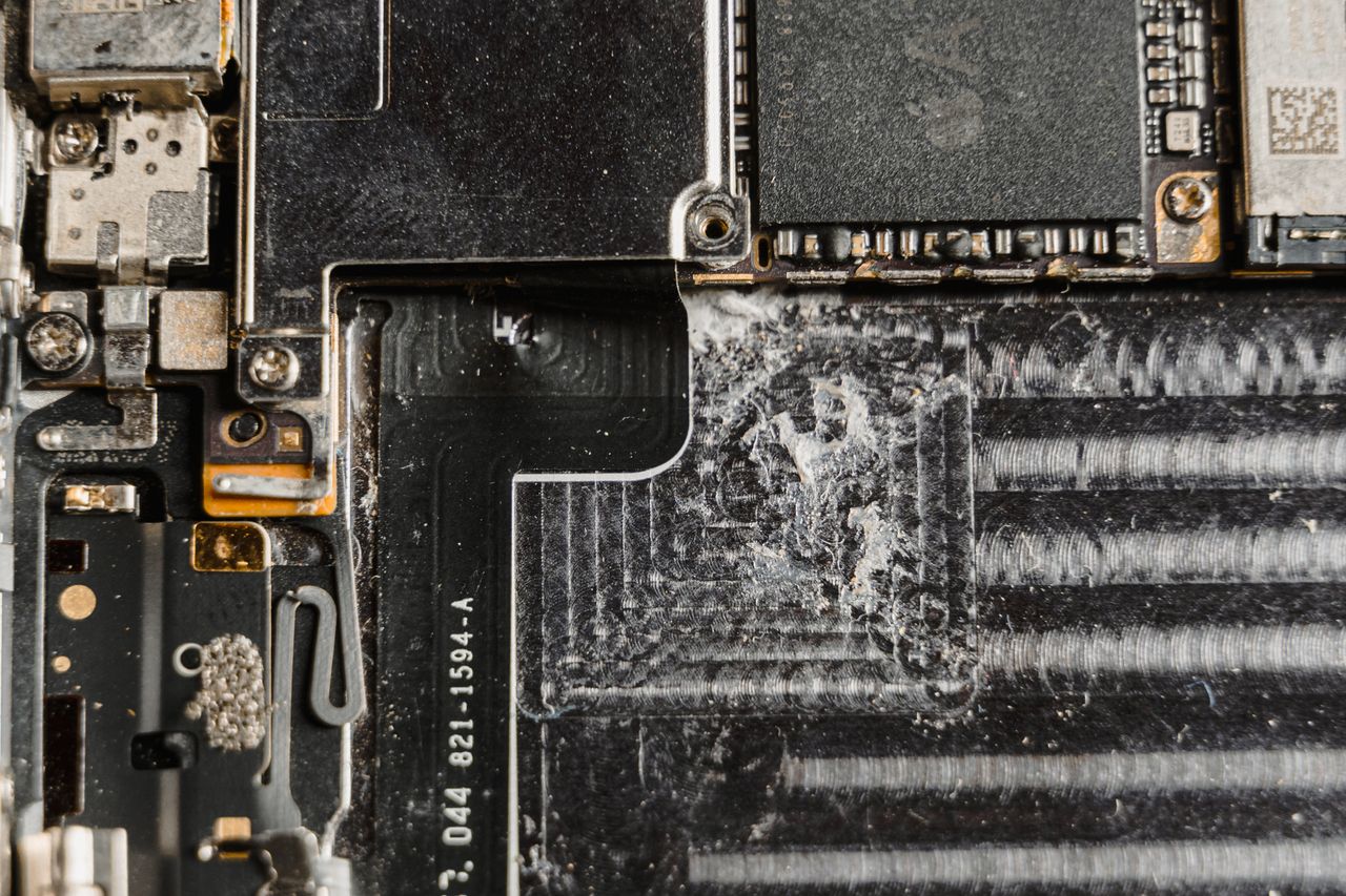 The Art of Drawing Readers In: Your attractive post title goes here Detailed close-up of a dusty mobile phone circuit board showcasing various electronic components.